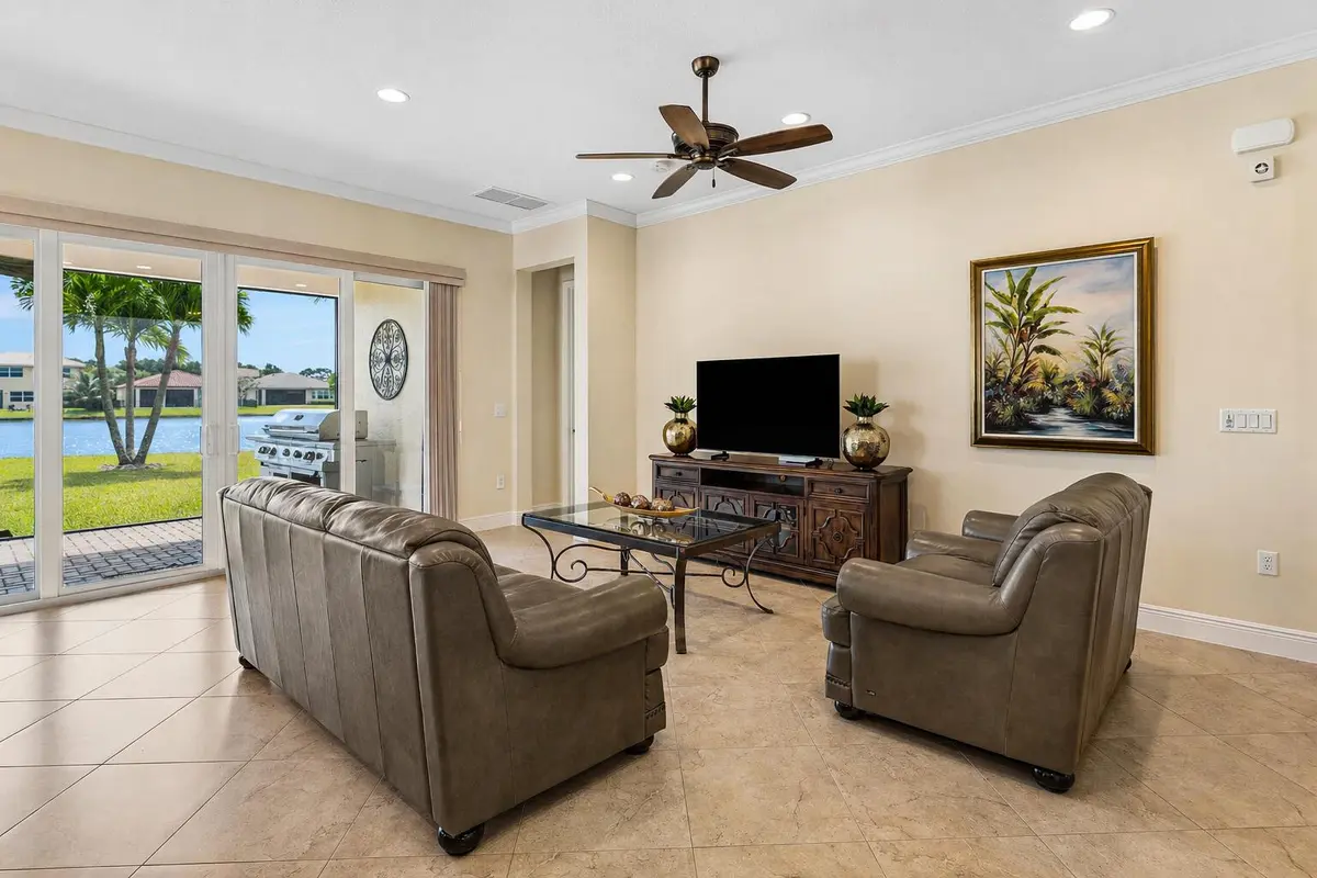 Living Room w/ Water Views at 3028 Strada Court, Royal Palm Beach