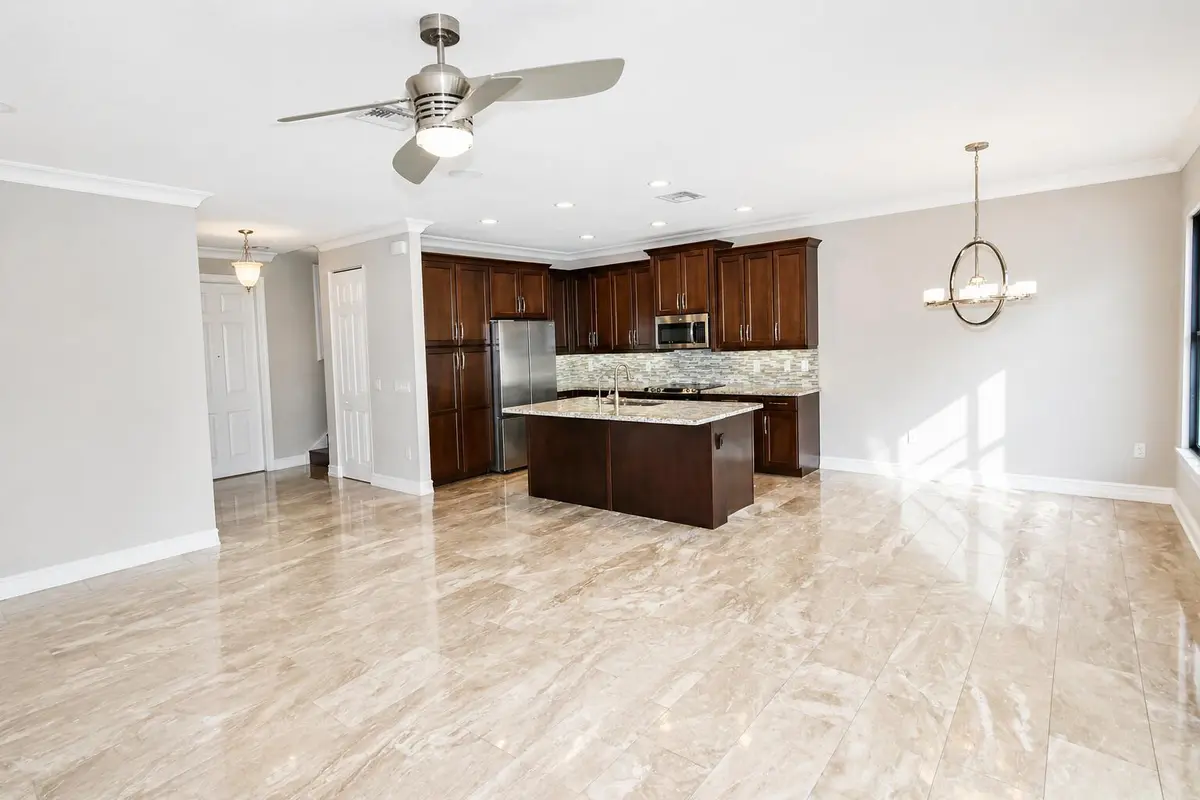 kitchen and living new at 8079 Snowflake Obsidian Trail, Delray Beach