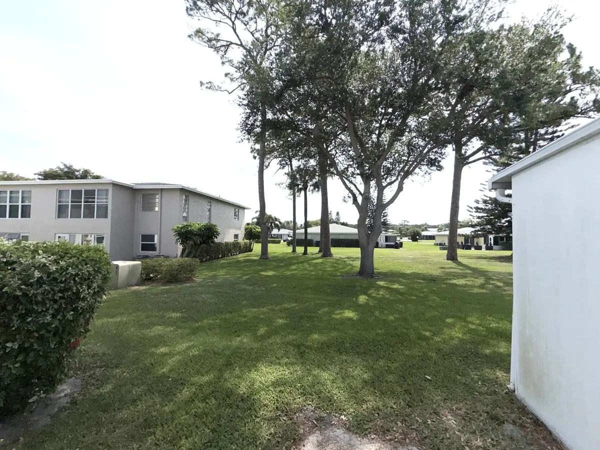 View into backyard at 1030 Silk Oak Terrace 101, Delray Beach
