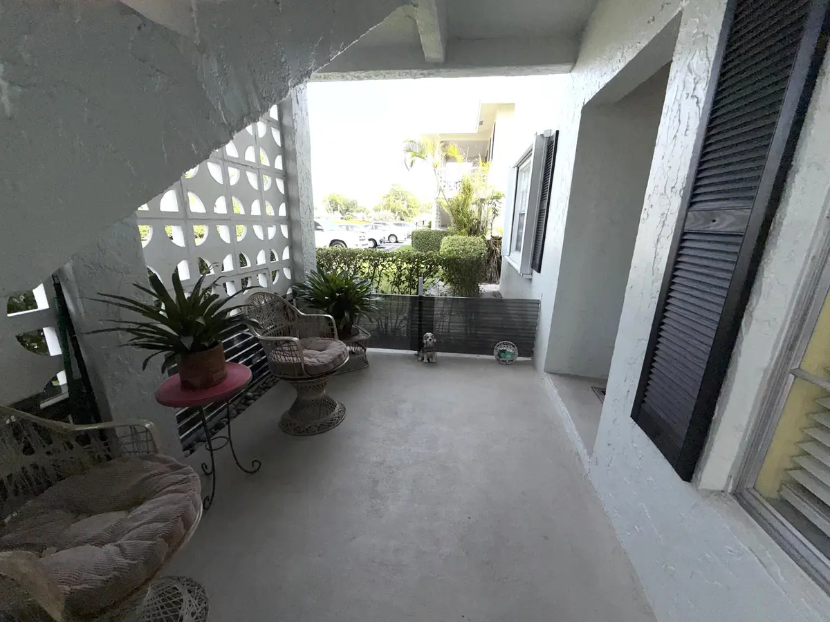 Covered front patio area at 1030 Silk Oak Terrace 101, Delray Beach