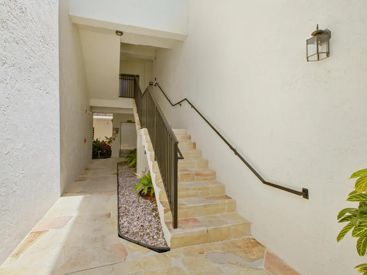 Building Entry Hallway Stairs at 5157 Floria Way J, Boynton Beach