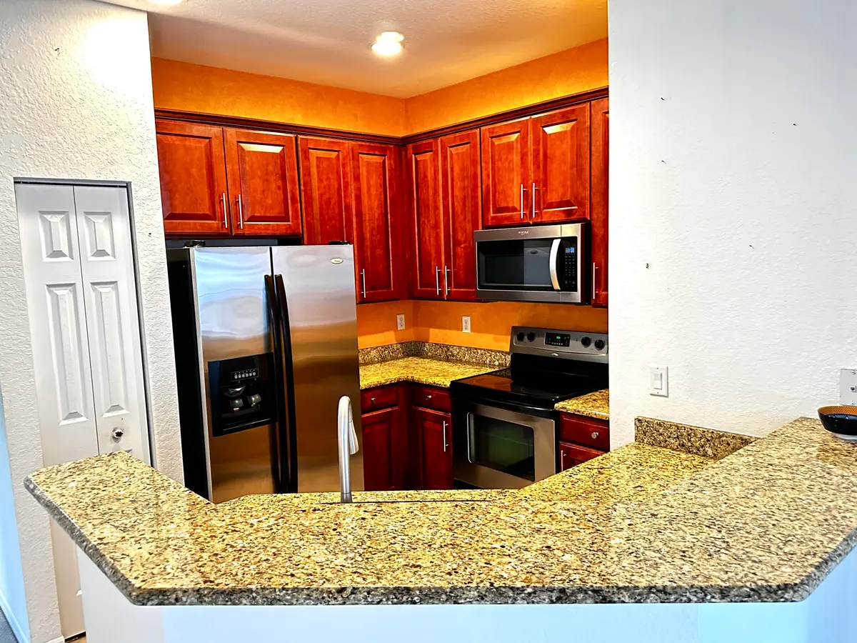 Kitchen from LR at 3031 SE Lexington Lakes Drive 204, Stuart
