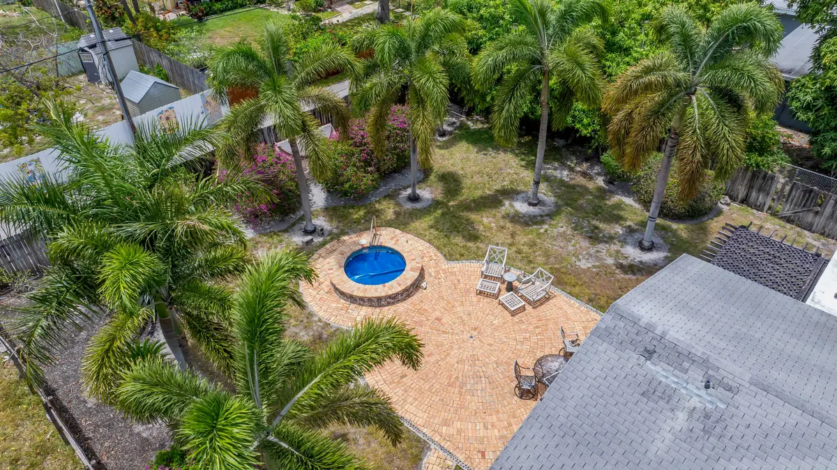 Large fenced yard with inground spa at 730 SE 4th Avenue, Delray Beach
