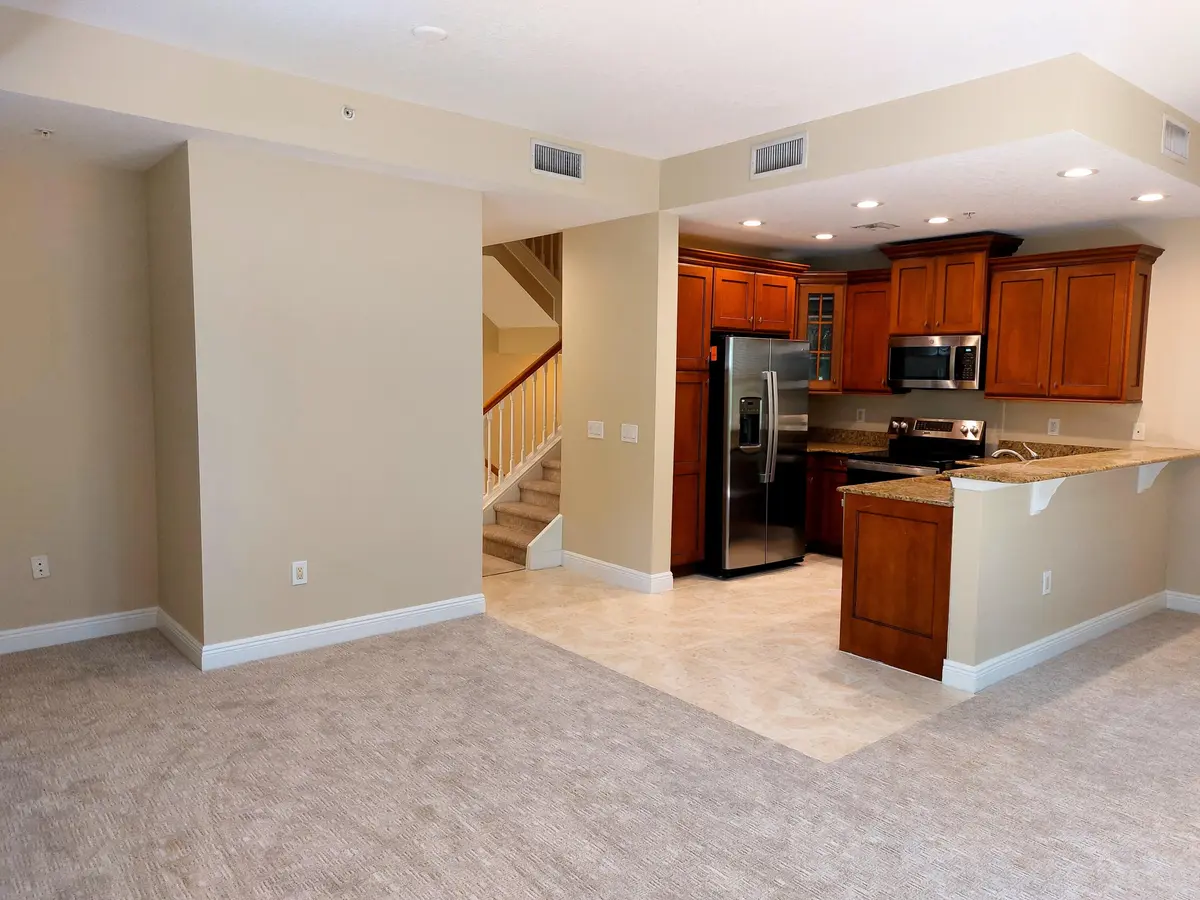 Tranquility main level family kitchen at 12675 SE Old Cypress Drive 903, Hobe Sound