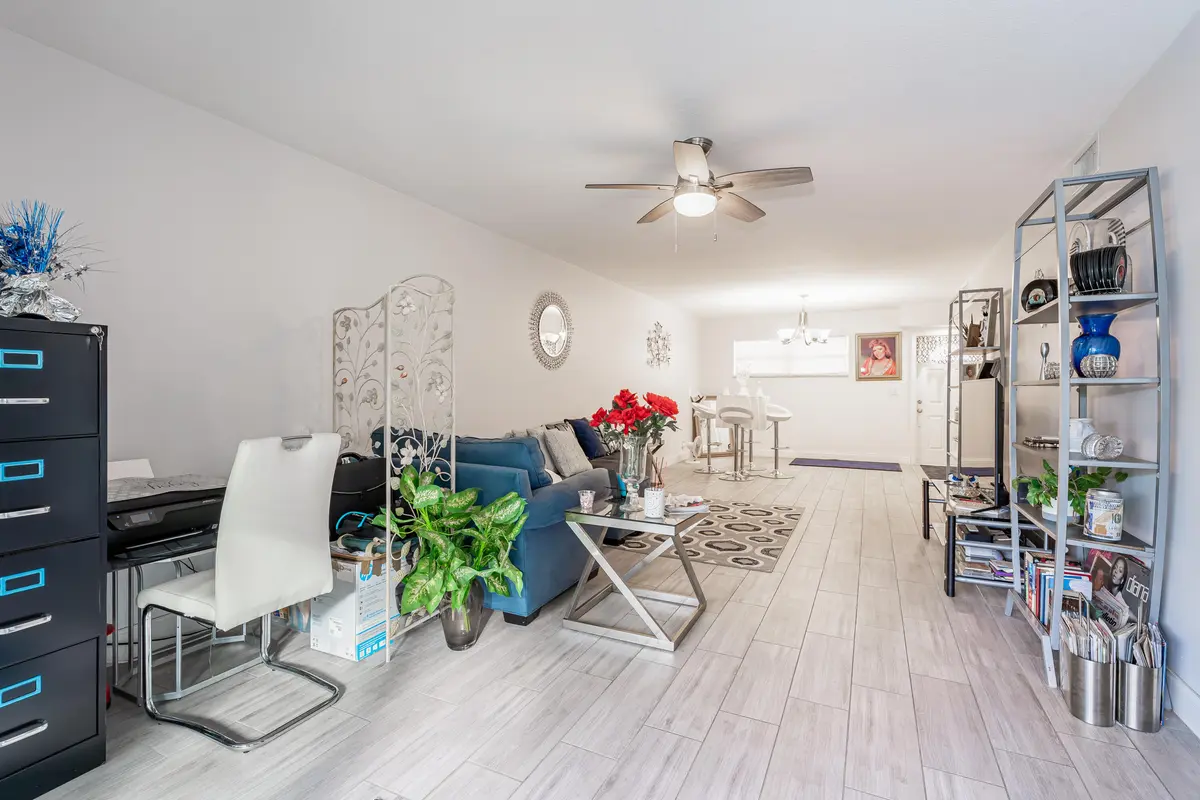 2. Living Room to Dining Room 1 at 8911 S Hollybrook Boulevard 306, Pembroke Pines