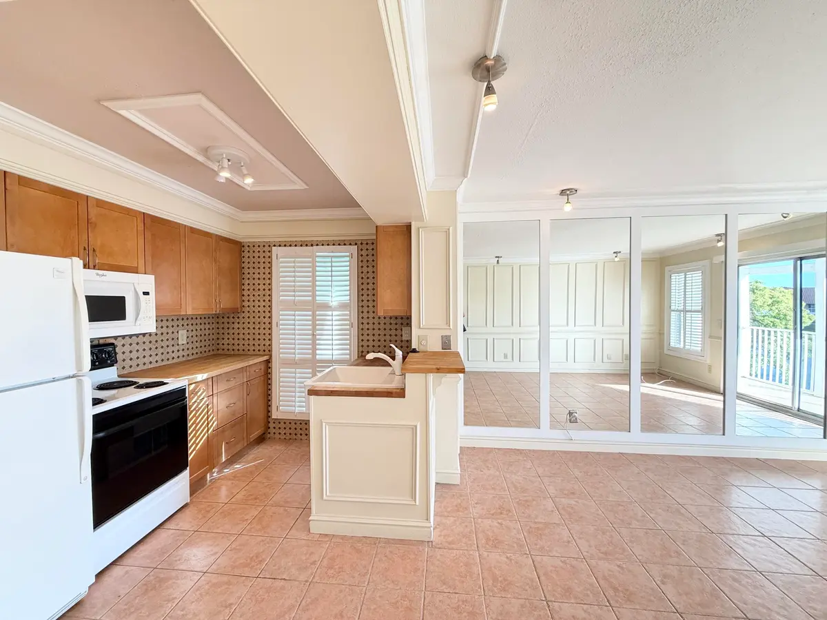 living room kitchen at 273 Cypress Point Drive, Palm Beach Gardens