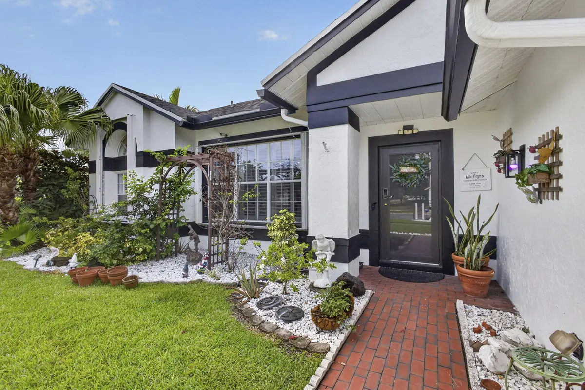 102 Royal Palm Front door at 102 E Royal Pine Cir, Royal Palm Beach