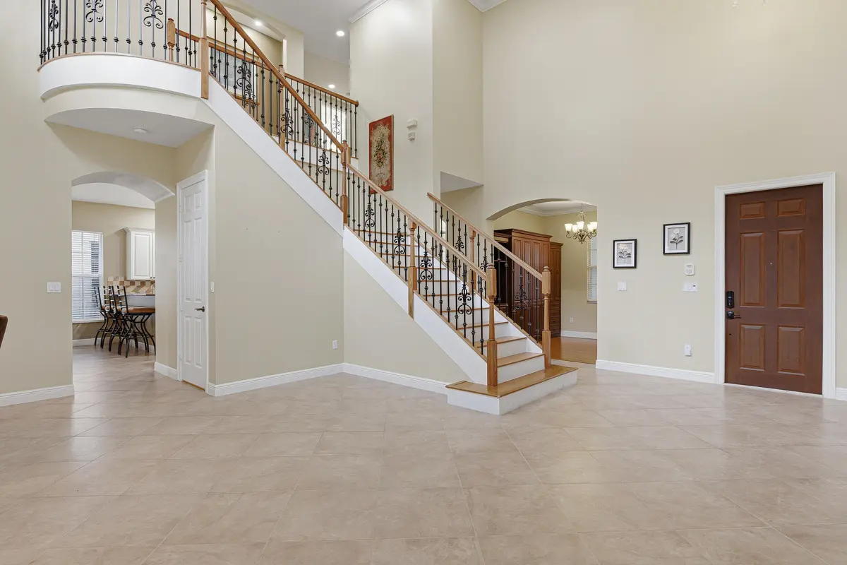 Living Room & Front Door at 946 Mill Creek Drive, Palm Beach Gardens
