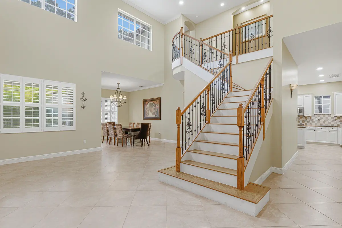 Living Room & Stairwell at 946 Mill Creek Drive, Palm Beach Gardens