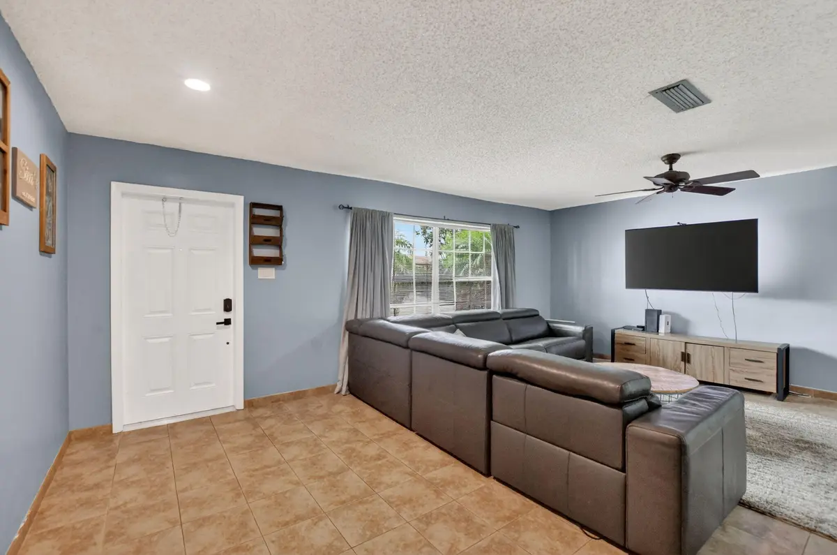 View of front door from living room at 1140 NW 49th Street, Deerfield Beach