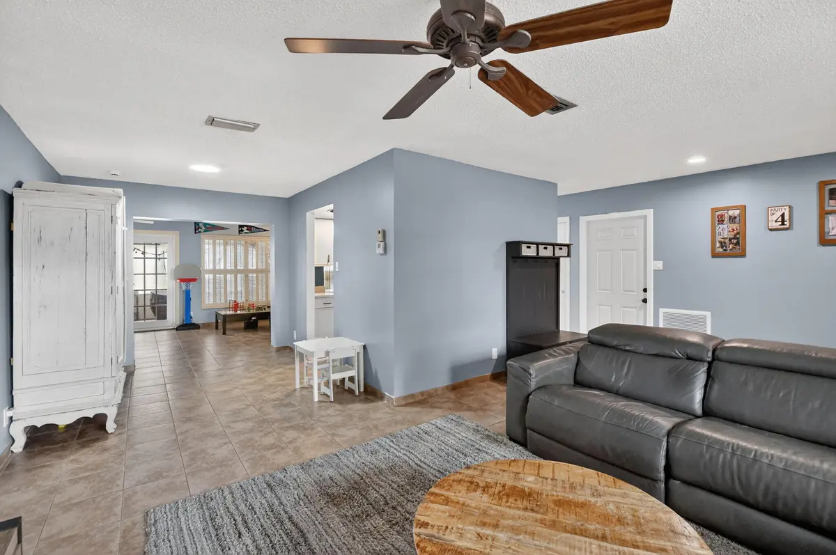 Living room into possible dining room at 1140 NW 49th Street, Deerfield Beach