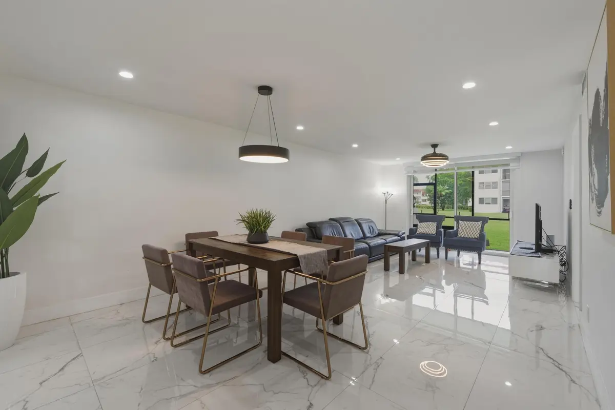 2. Dining Room to Living Room and Patio at 9523 N Hollybrook Lake Drive 103, Pembroke Pines
