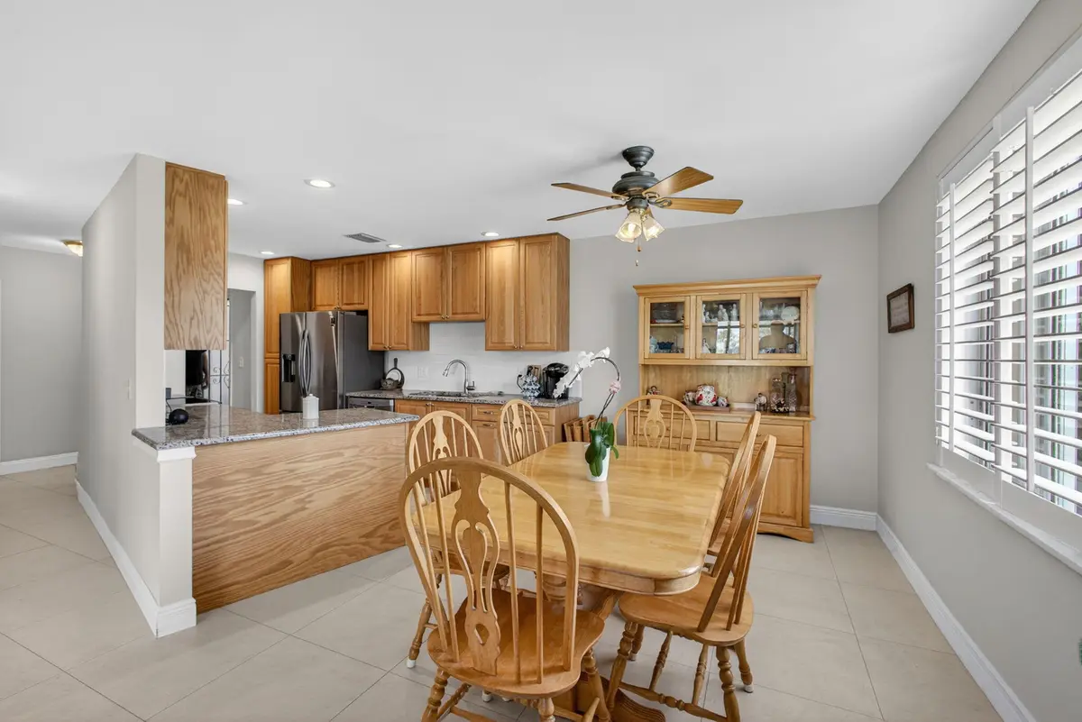 Kitchen and Dining Area at 11811 Avenue Of The Pga 7-2a, Palm Beach Gardens