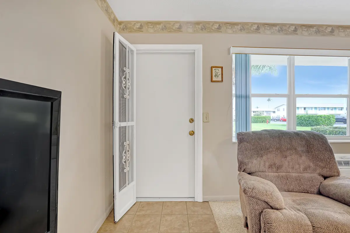 Screened front door at 680 Horizon 110, Boynton Beach