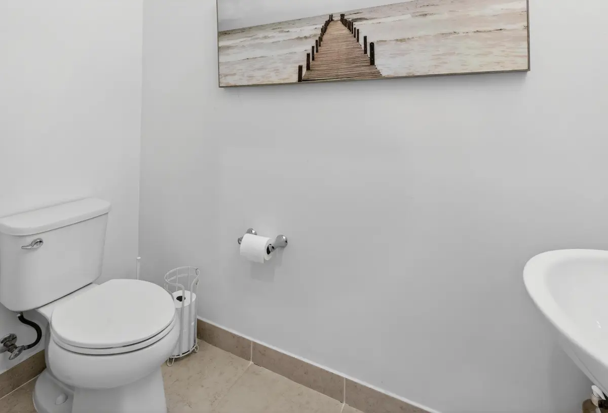 Down Stairs Half Bath at 1823 Sandpiper Pointe Place, Deerfield Beach