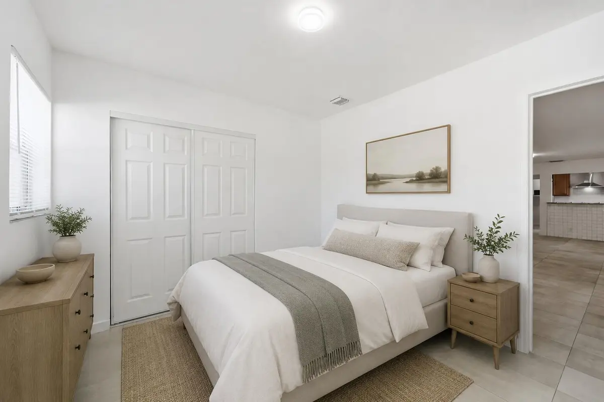 Virtually staged bedroom at 629 NE 36th Street, Oakland Park