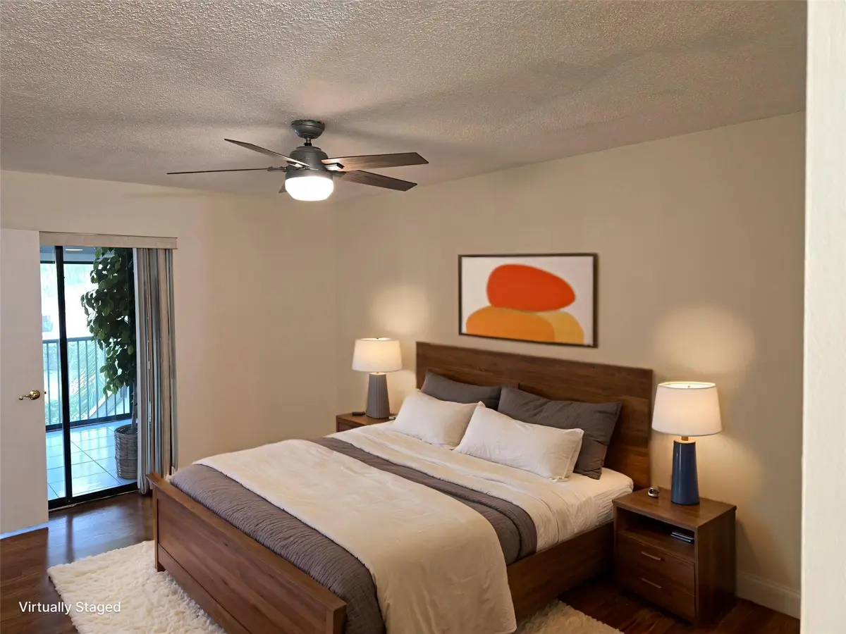 Primary Bedroom - AI Furnished at 4049 N Carambola Circle, Coconut Creek