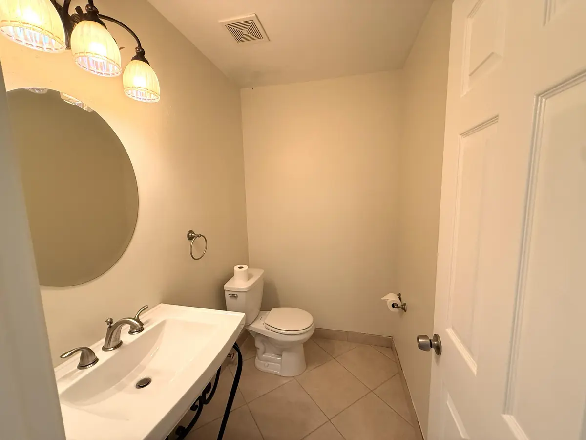 Half Bath at 735 Hummingbird Way 202, North Palm Beach