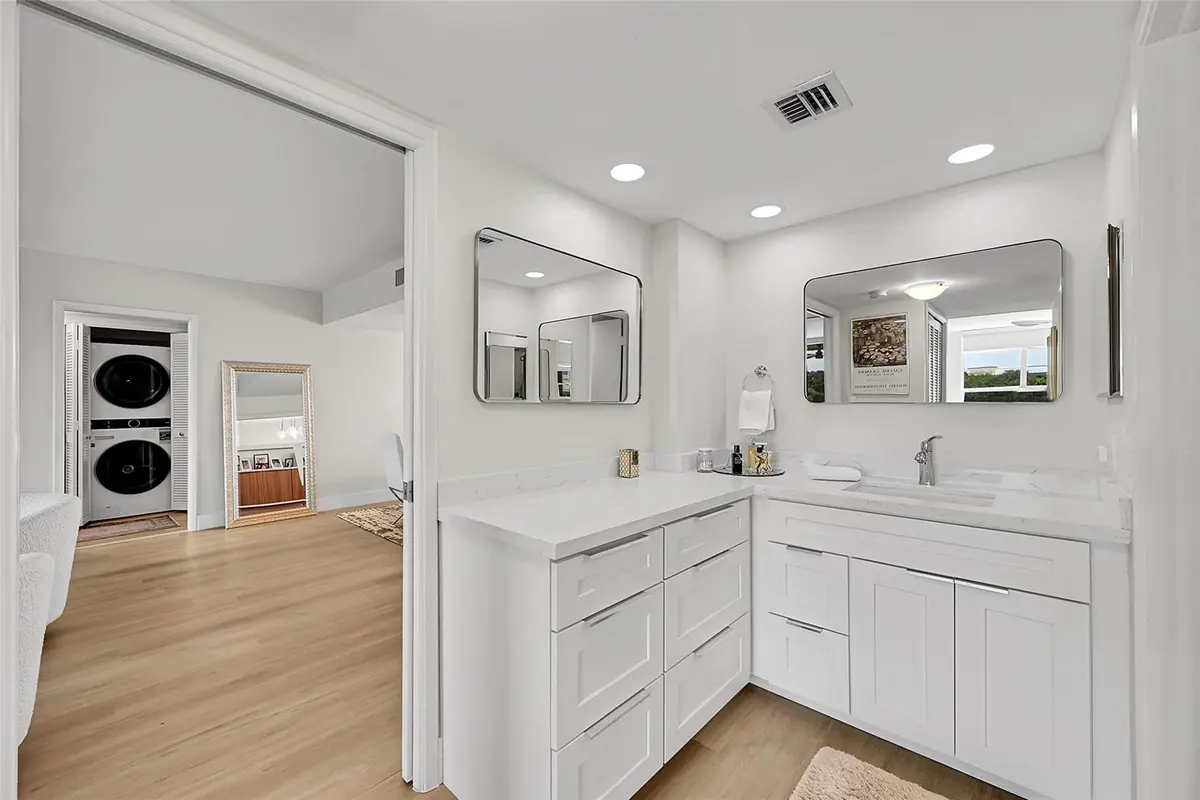 Primary En Suite Bathroom Vanity Area at 555 Oaks Lane 311, Pompano Beach