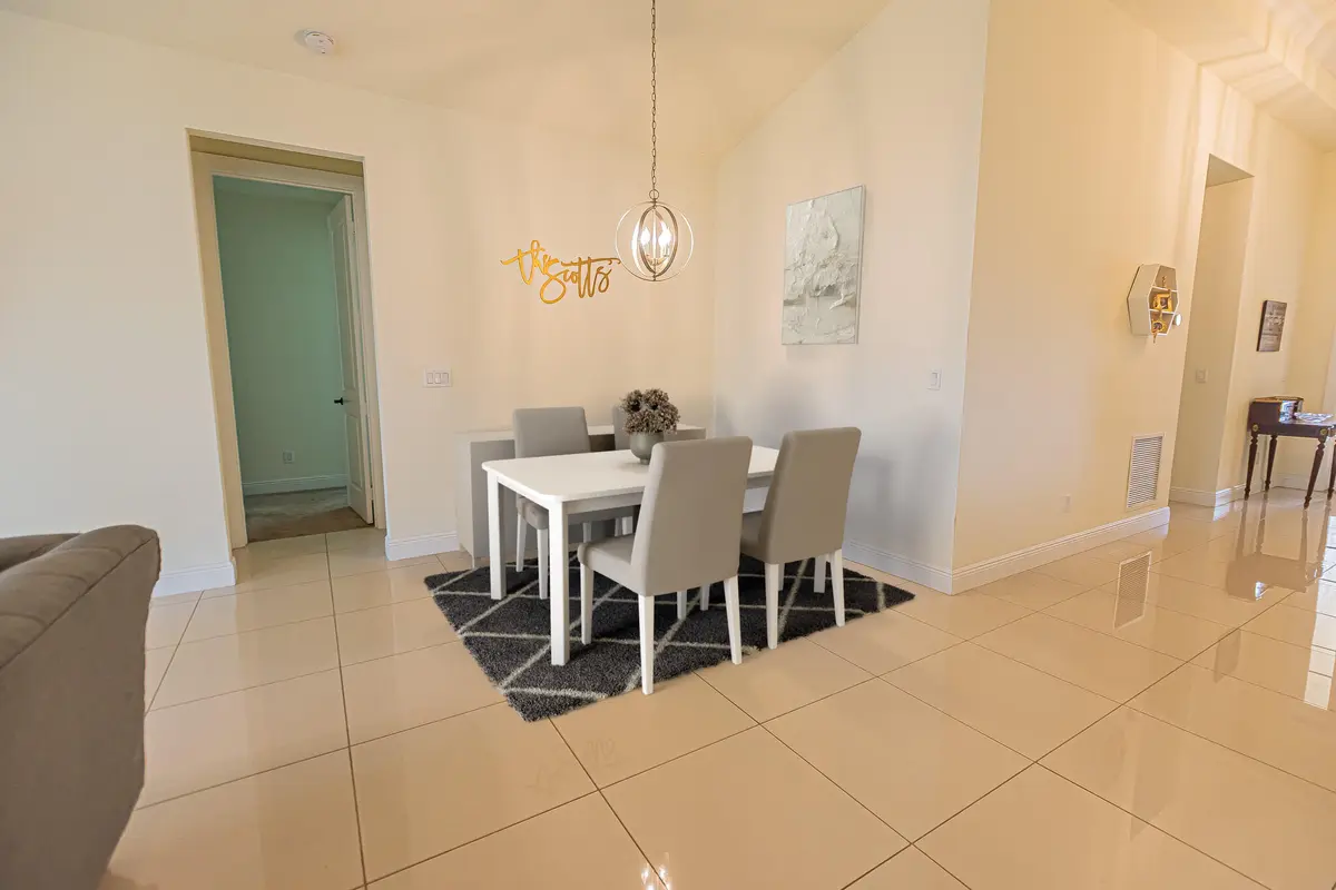 virtually staged - dining at 930 SW Versailles Avenue, Port St. Lucie