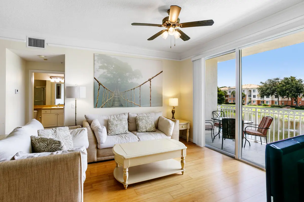 Living room with lake view at 10208 Myrtlewood Circle, Palm Beach Gardens