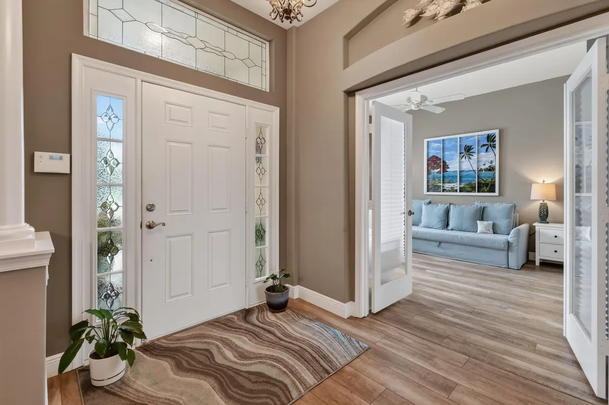 Transome Window above Front Entry Door at 4577 NW Red Bay Circle, Jensen Beach