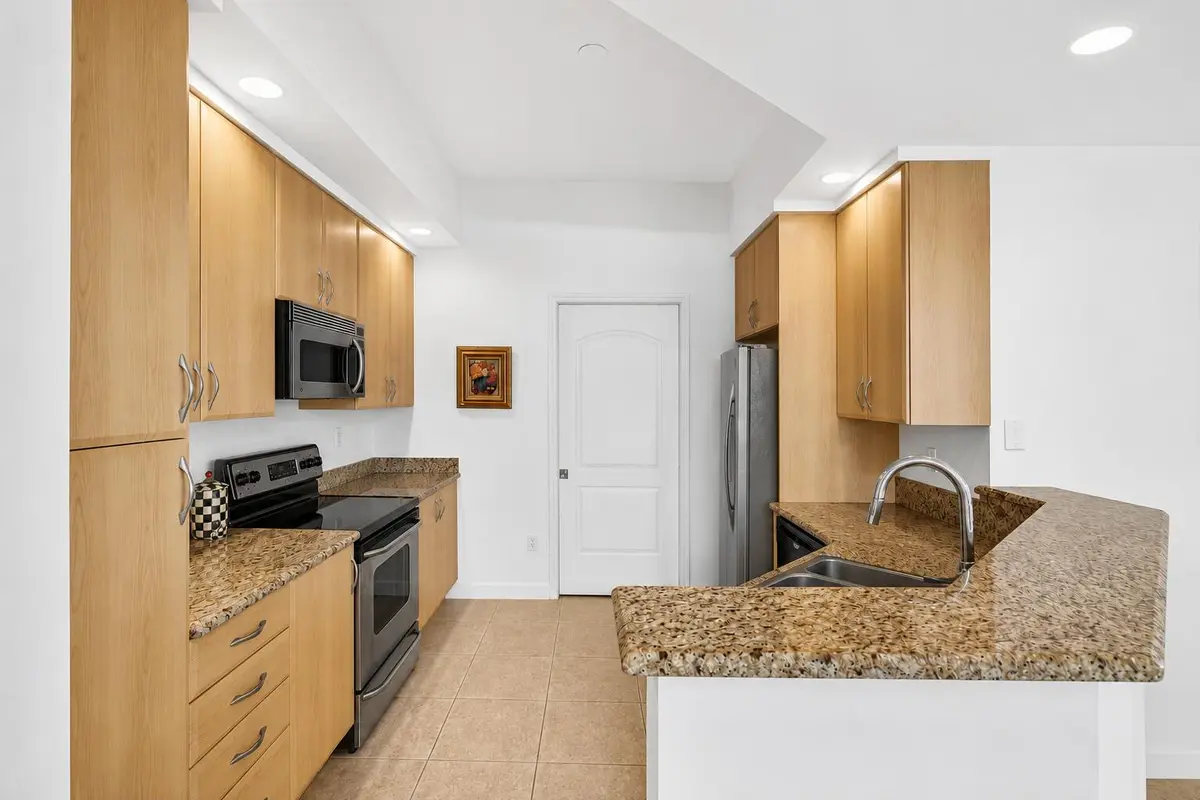 Kitchen w/ Ample Cabinetry at 801 S Olive Avenue 1119, West Palm Beach