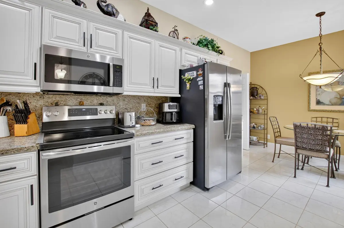 kitchen and eat=in dining area at 10632 Royal Caribbean Circle, Boynton Beach