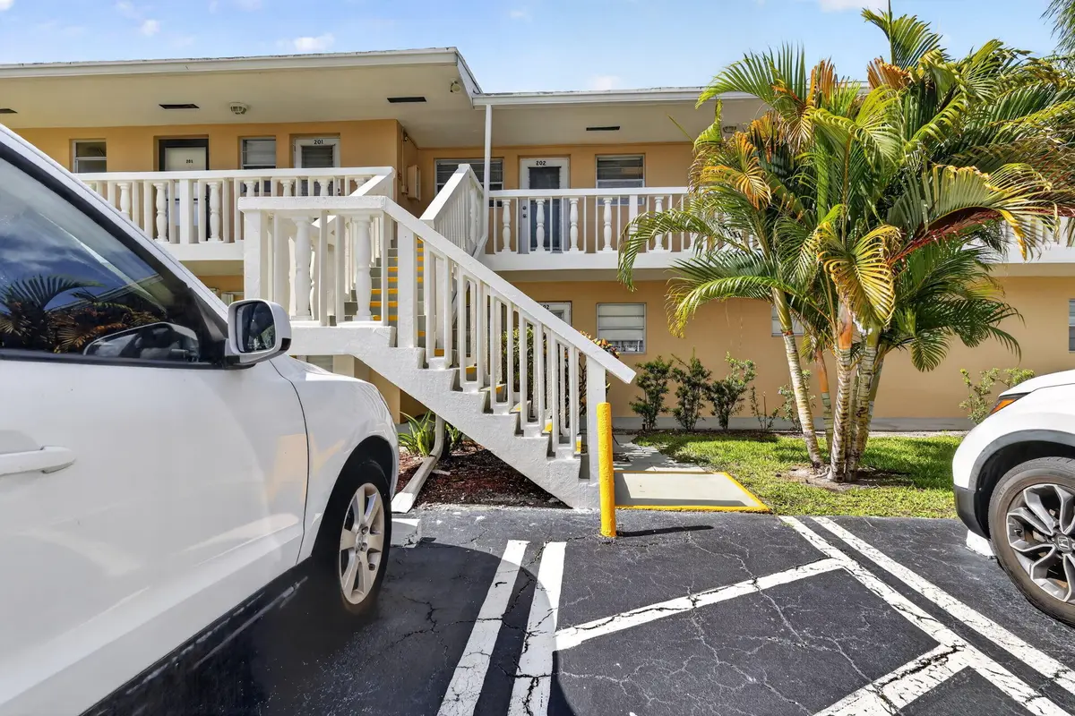 Stairs directly lead to the front door at 2182 NE 1st Way 202, Boynton Beach