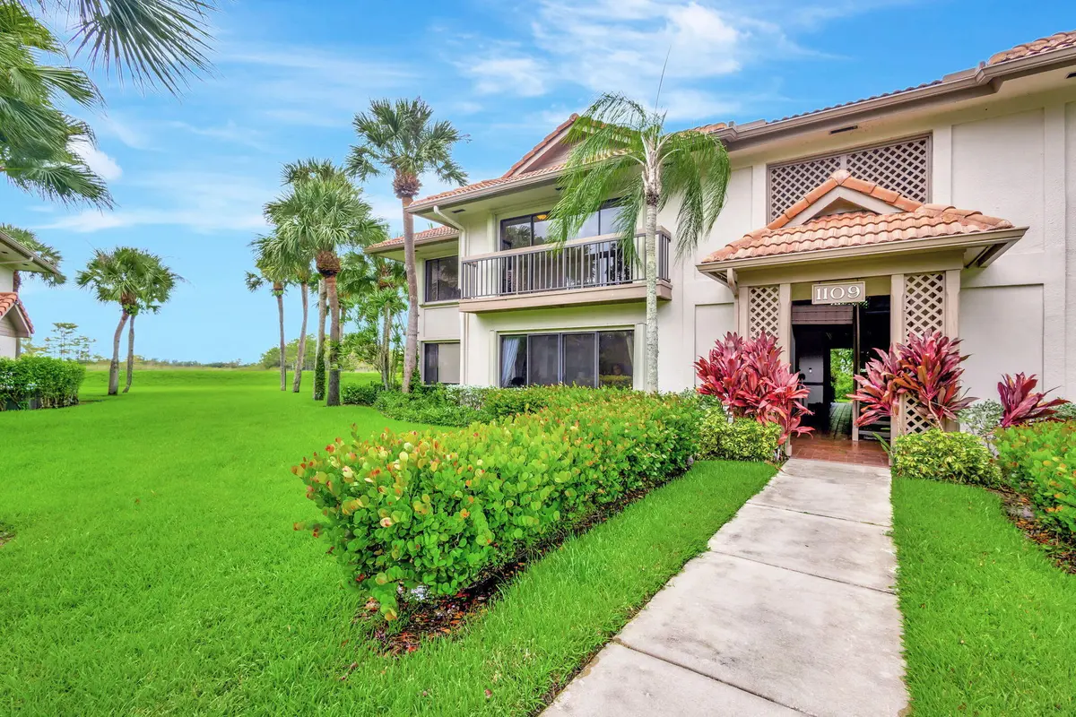 0A - Front of Building and Side Yard at 1109 Duncan Circle 201, Palm Beach Gardens