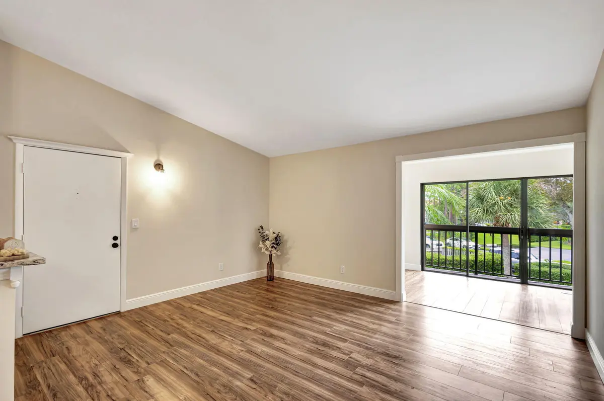Great Room with Florida Room View at 1109 Duncan Circle 201, Palm Beach Gardens