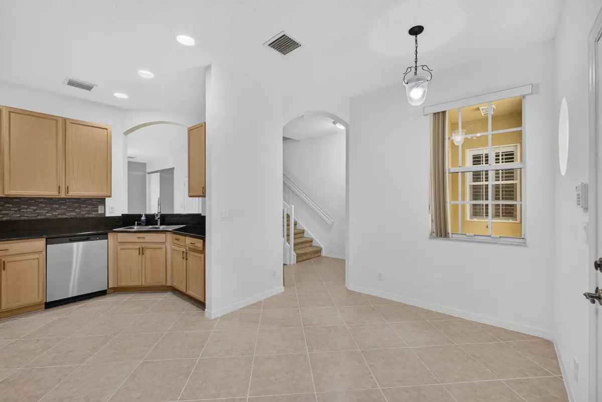 Kitchen & Dining Area at 4991 Bonsai Circle 107, Palm Beach Gardens