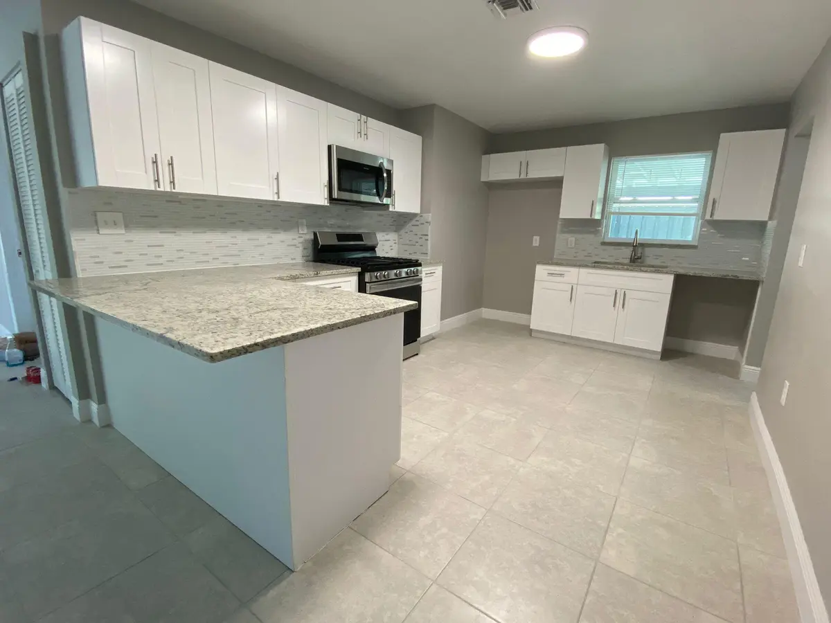 Wood Kitchen W/Granite Counters at 9121 Bamboo Drive, Palm Beach Gardens