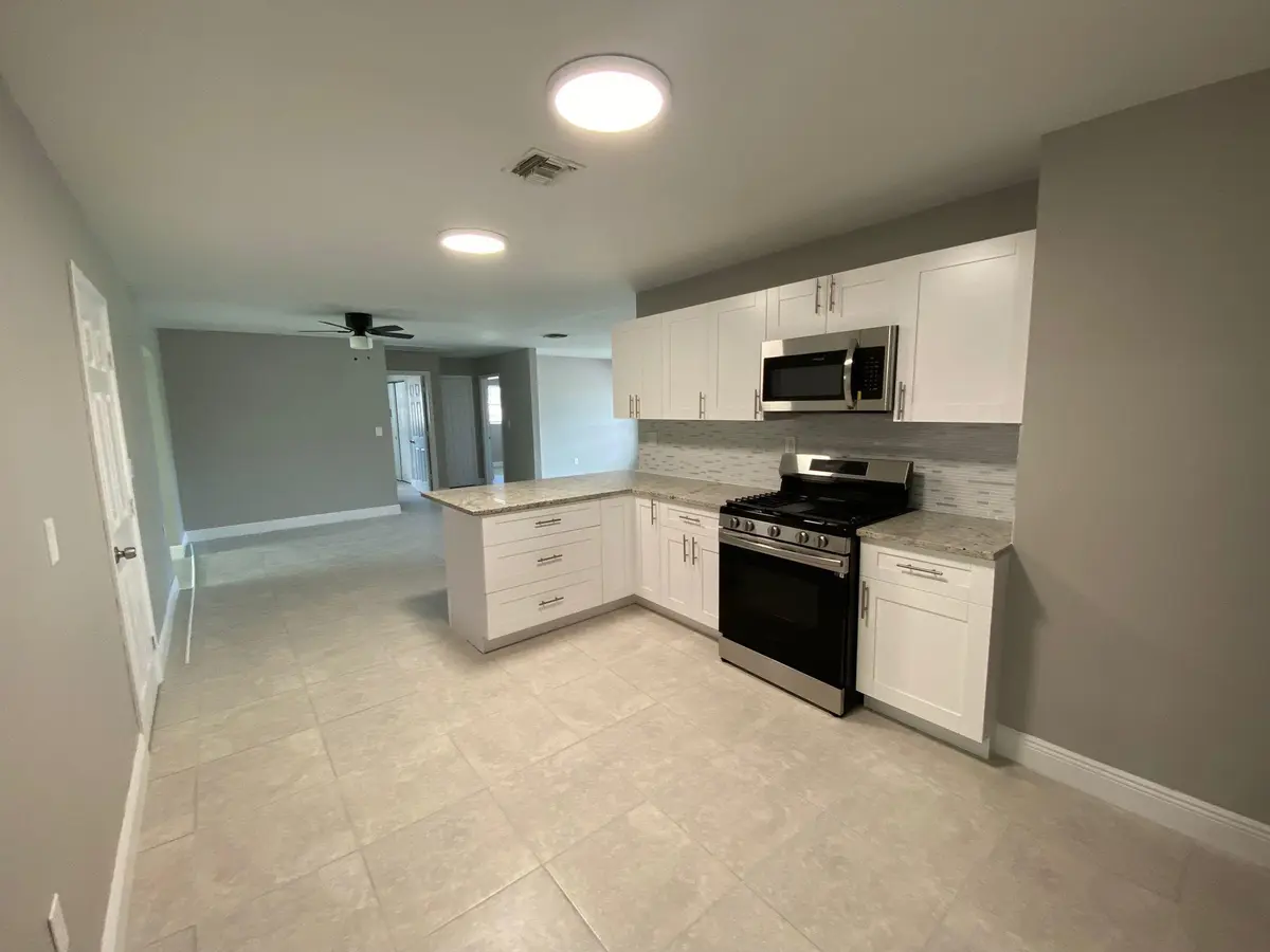 Wood Kitchen W/Granite Counters at 9121 Bamboo Drive, Palm Beach Gardens