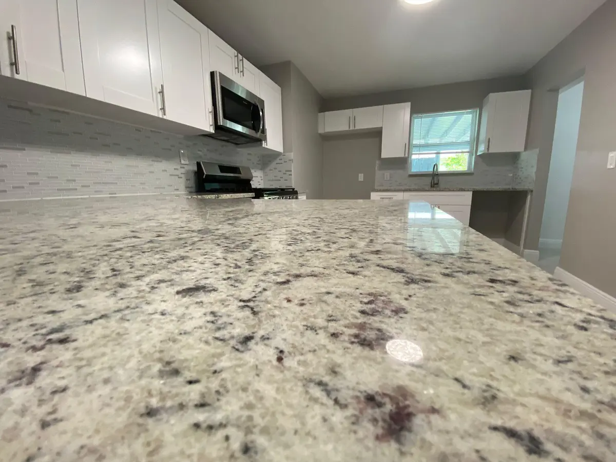 Wood Kitchen W/Granite Counters at 9121 Bamboo Drive, Palm Beach Gardens