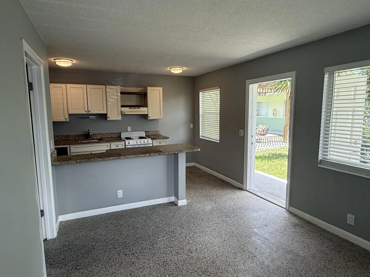 Living room and kitchen at 1118 N H Street 14, Lake Worth Beach