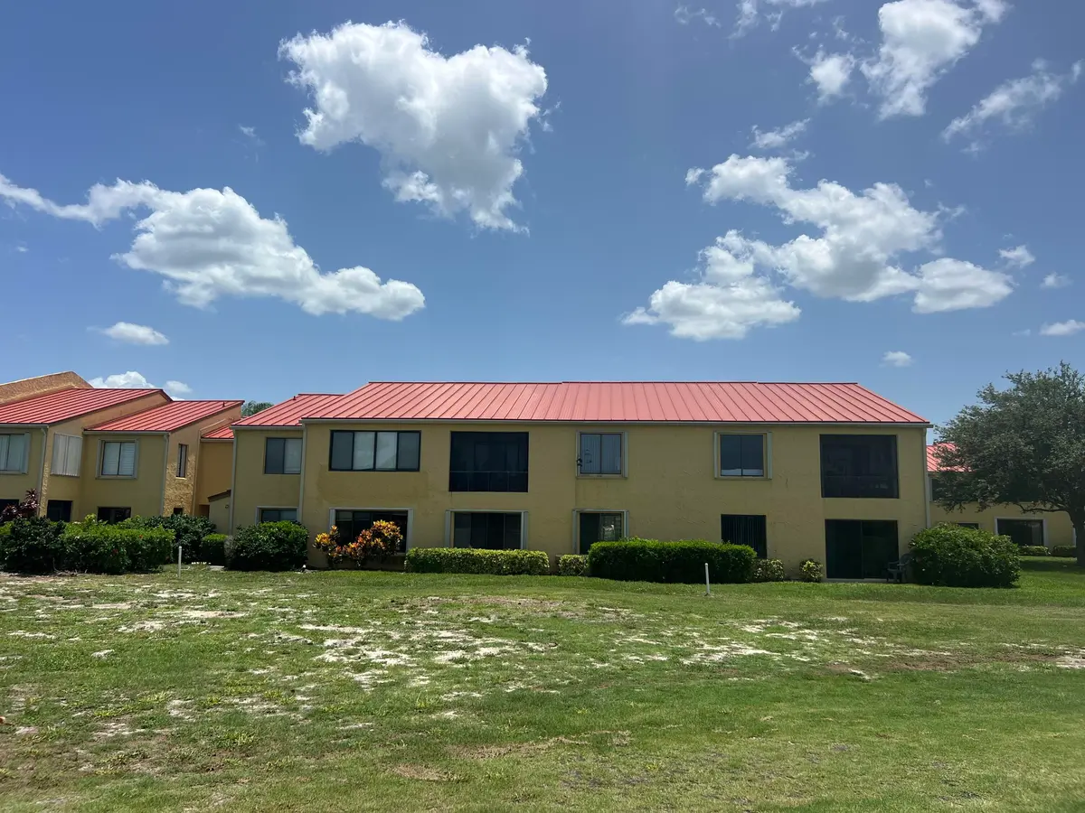 rear of condo at 5373 SE MILES GRANT Road 102, Stuart