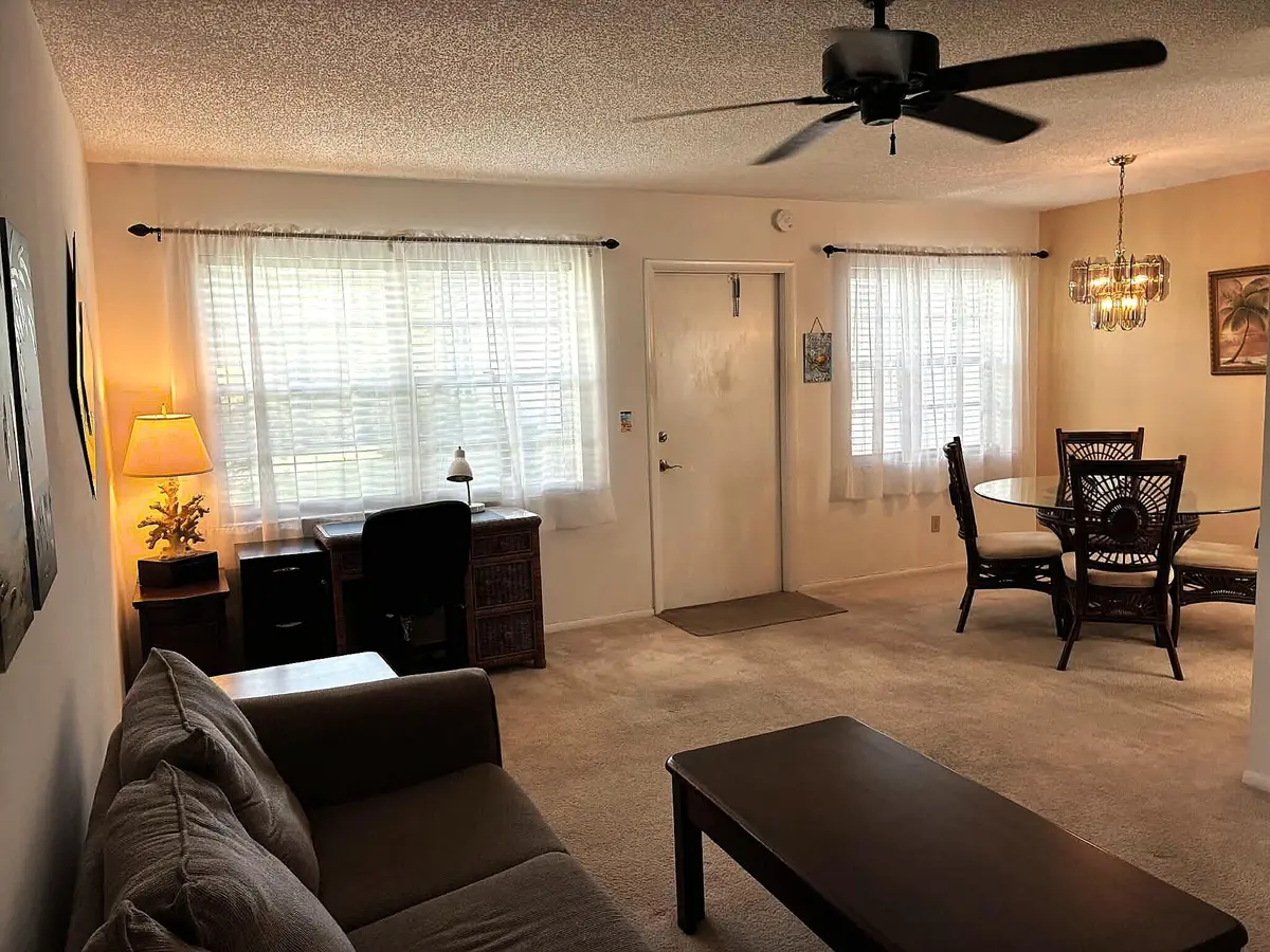 Living Room to Dining Room at 52 Woodland Drive 103, Vero Beach