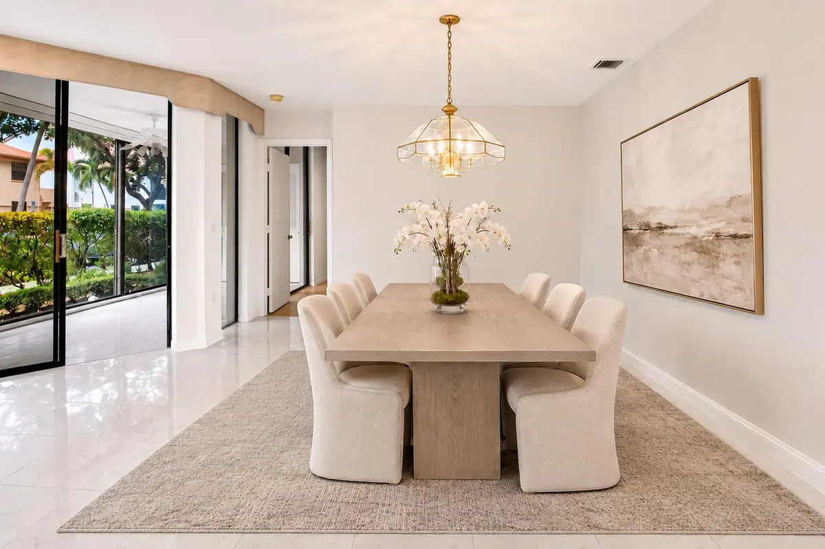 Virtually Staged Formal Dining Area at 5187 Europa Drive F, Boynton Beach