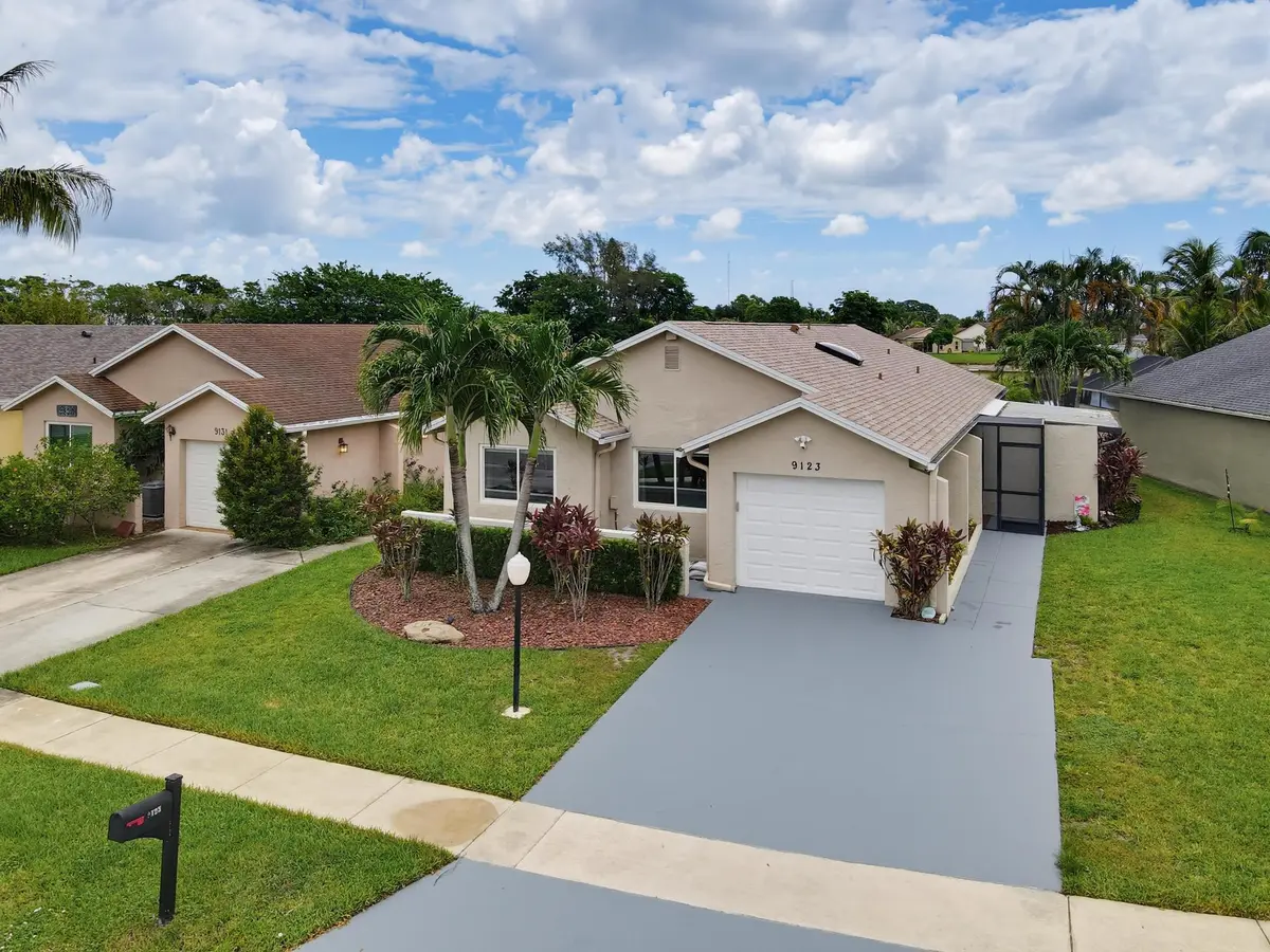 Lakefront Home Front Elevation at 9123 PINE SPRINGS Drive, Boca Raton