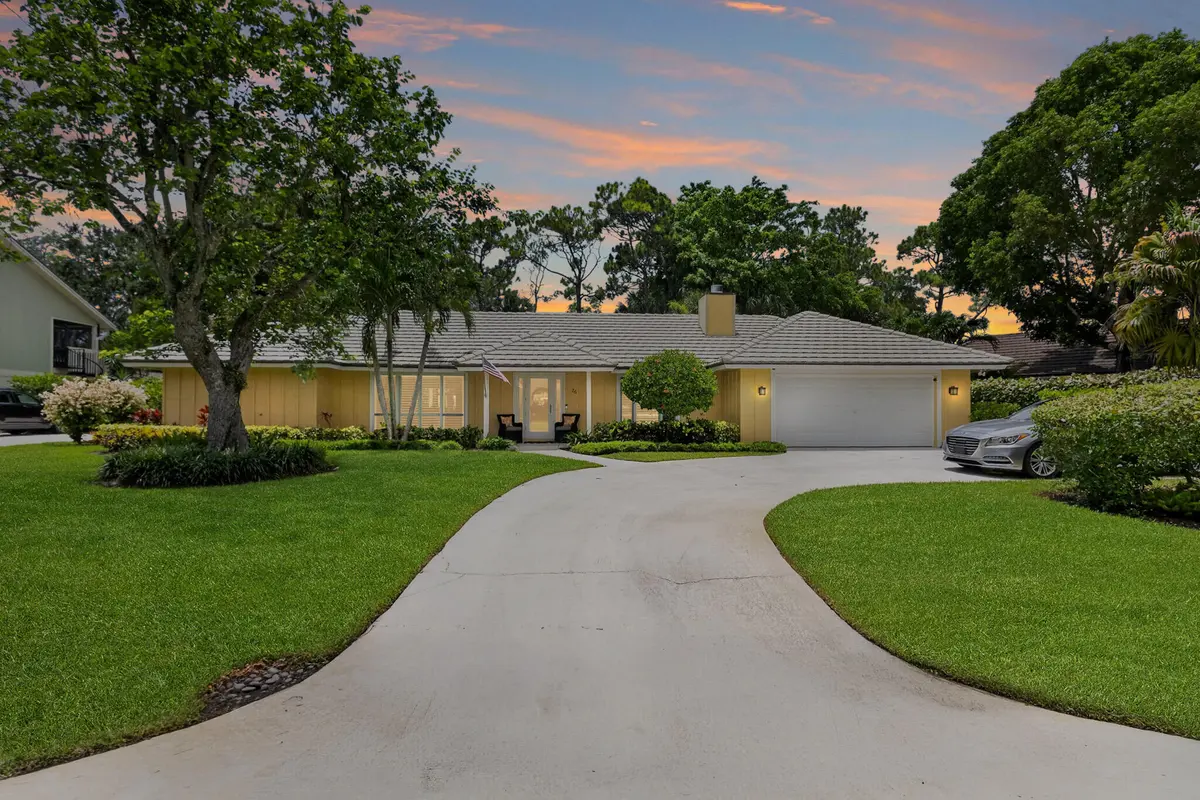 Front at Twilight at 26 Cambria Road, Palm Beach Gardens
