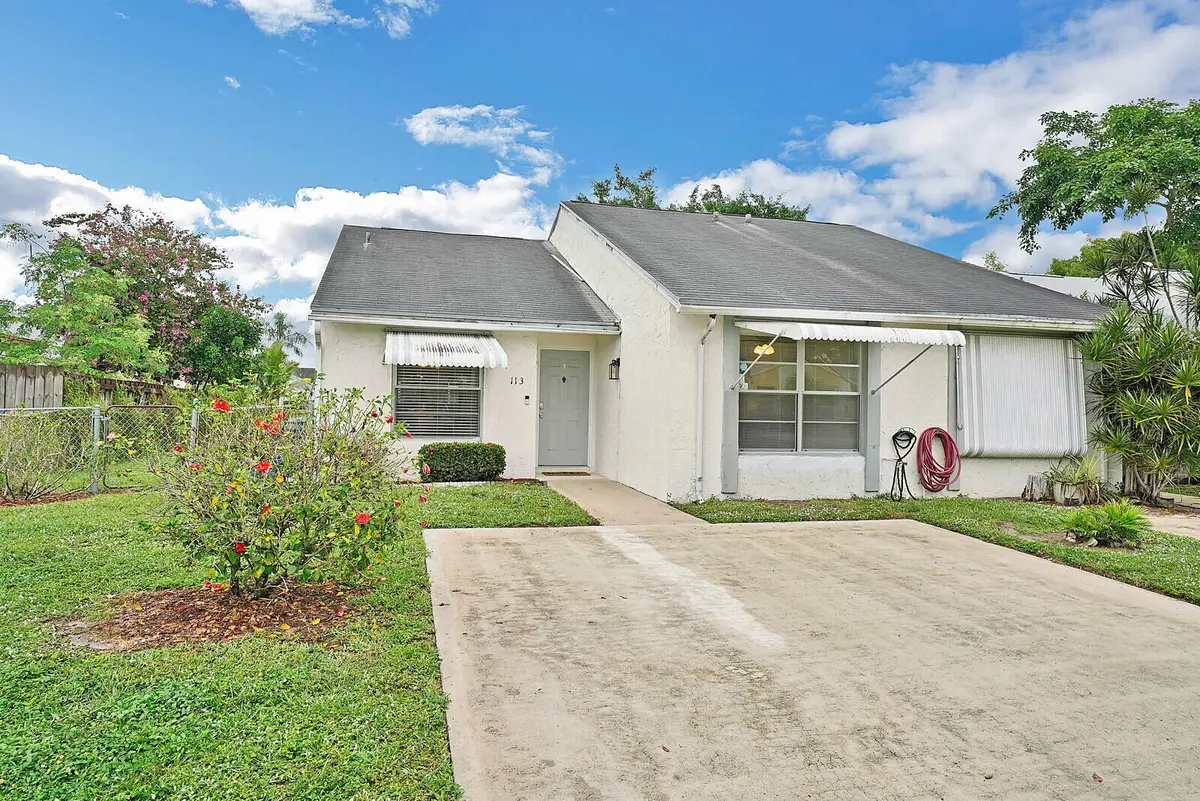 Front of the Home at 113 PINEWOOD Court, Jupiter
