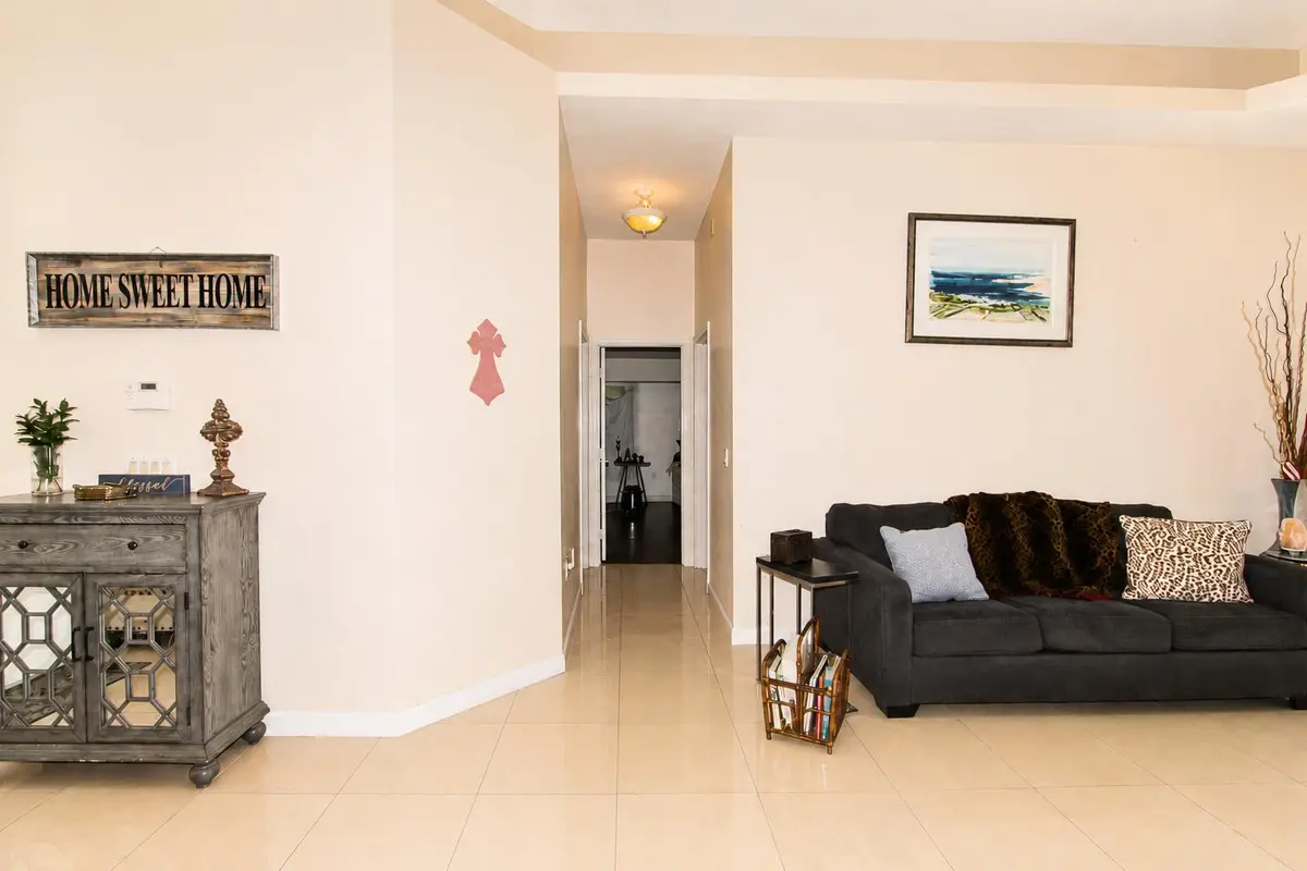 Living Room into Cabana and Primary at 1542 SW JASMINE Trace, Palm City