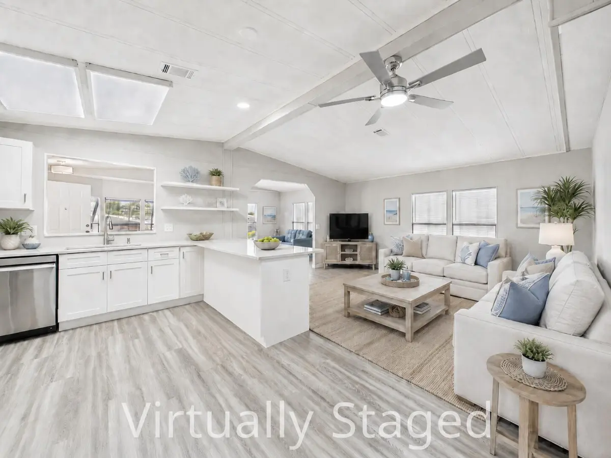 virtually staged Den:LR at 7831 SE Shenandoah Drive, Hobe Sound