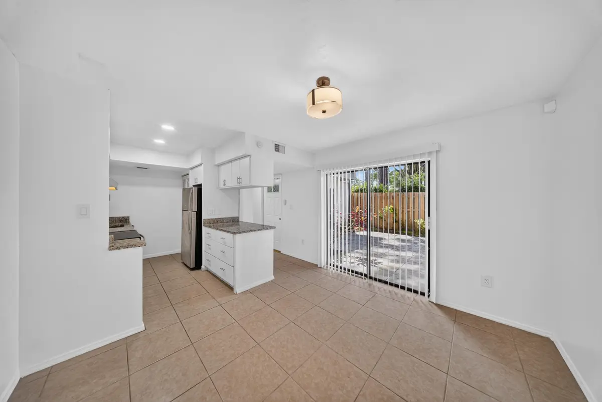Dining Area Access to Patio at 2811 Stoneway Lane A, Fort Pierce