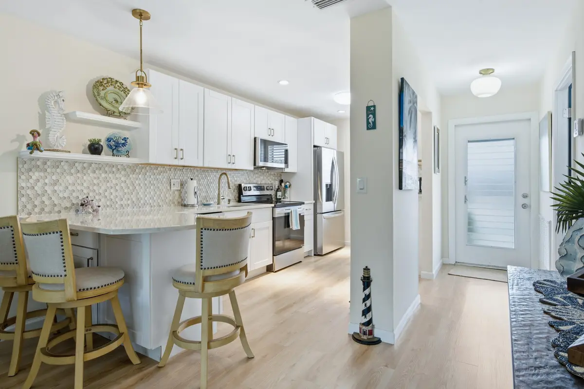 159 entryway and kitchen at 159 Lake Barbara Drive, West Palm Beach