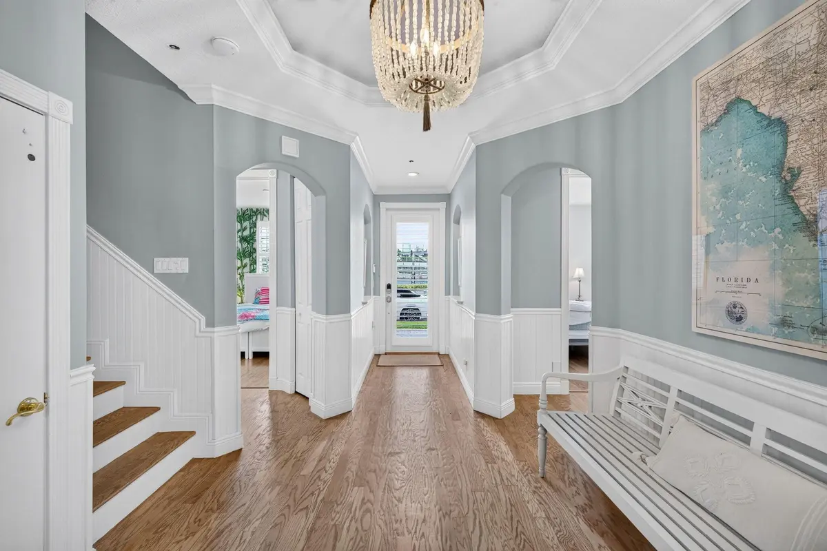 Foyer with high ceilings and wainscoting at 2814 Marina Circle, Lighthouse Point