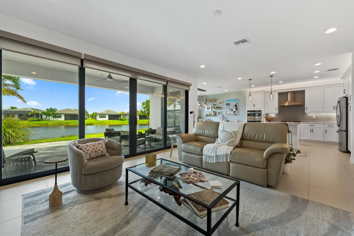 Living room overlooking lake at 12454 SW Alongshore Drive, Port St. Lucie