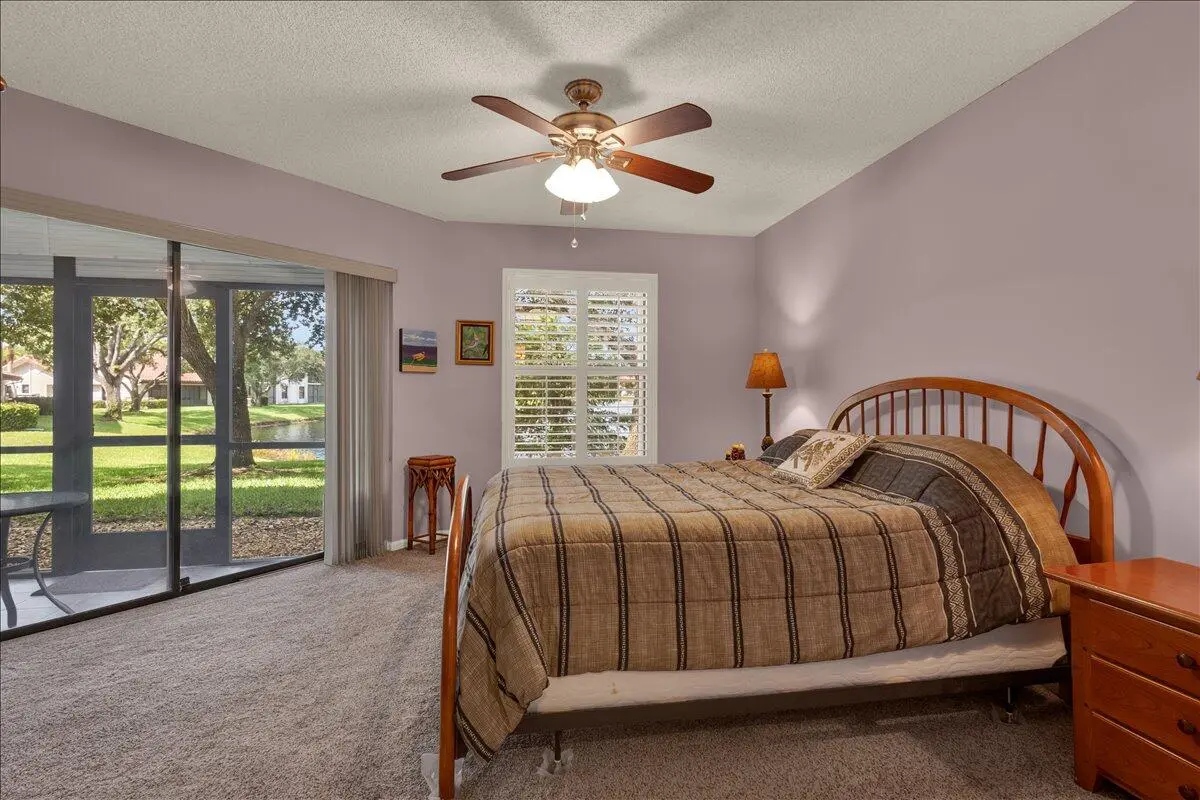 Master Bedroom/lake view at 6050 SE Martinique Drive 102, Stuart