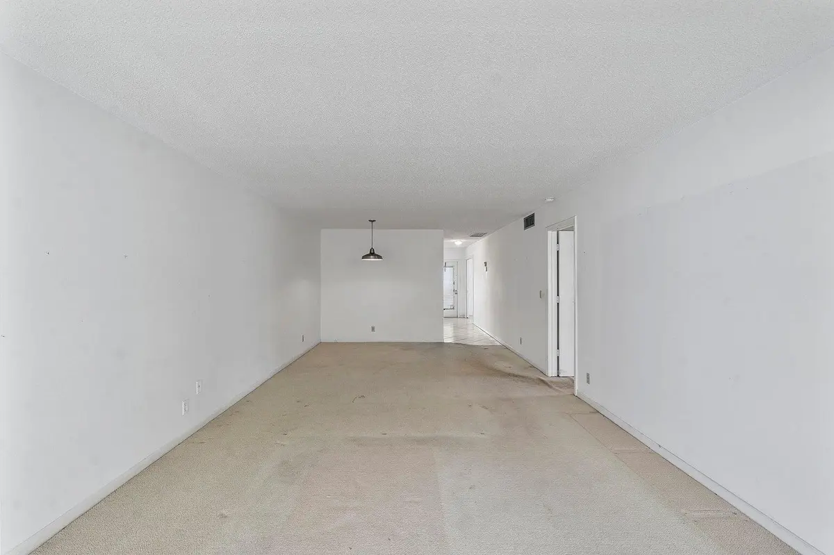 Living room to dining area at 1141 VIOLET Terrace 101, Delray Beach